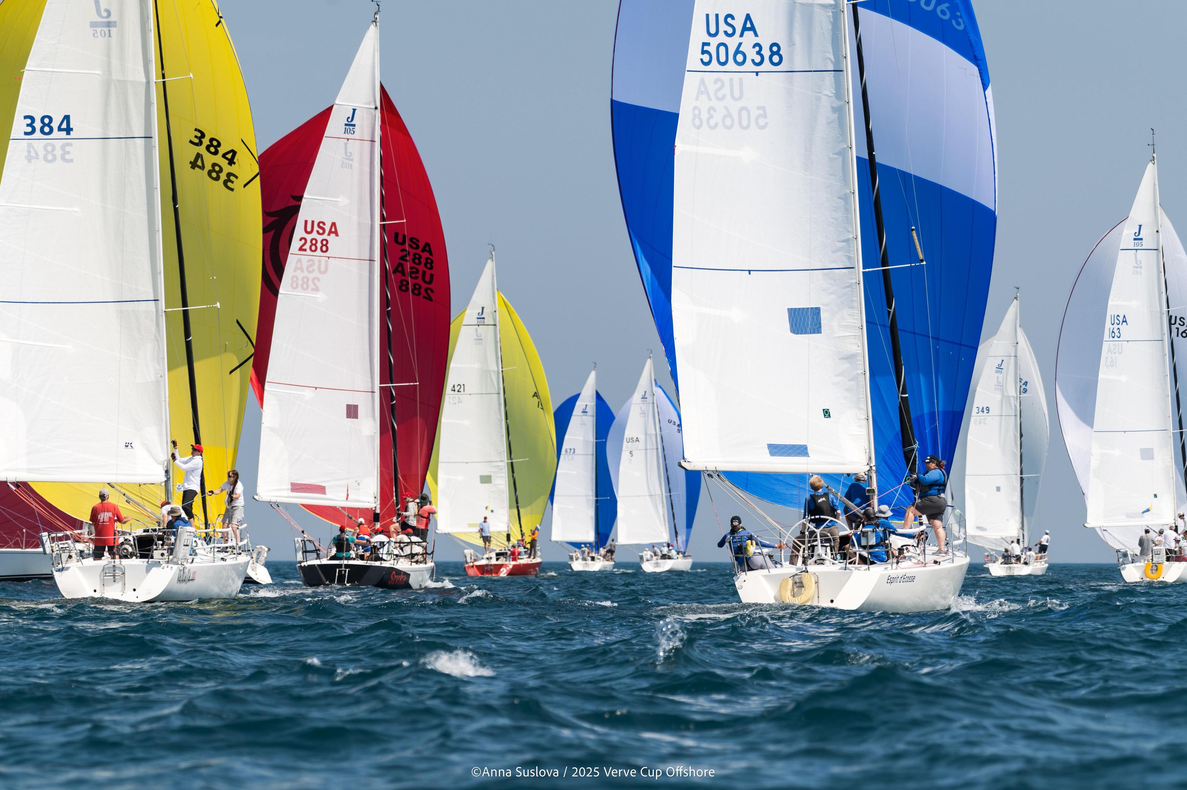 Lake Michigan sailboat fleet racing under colorful spinnakers